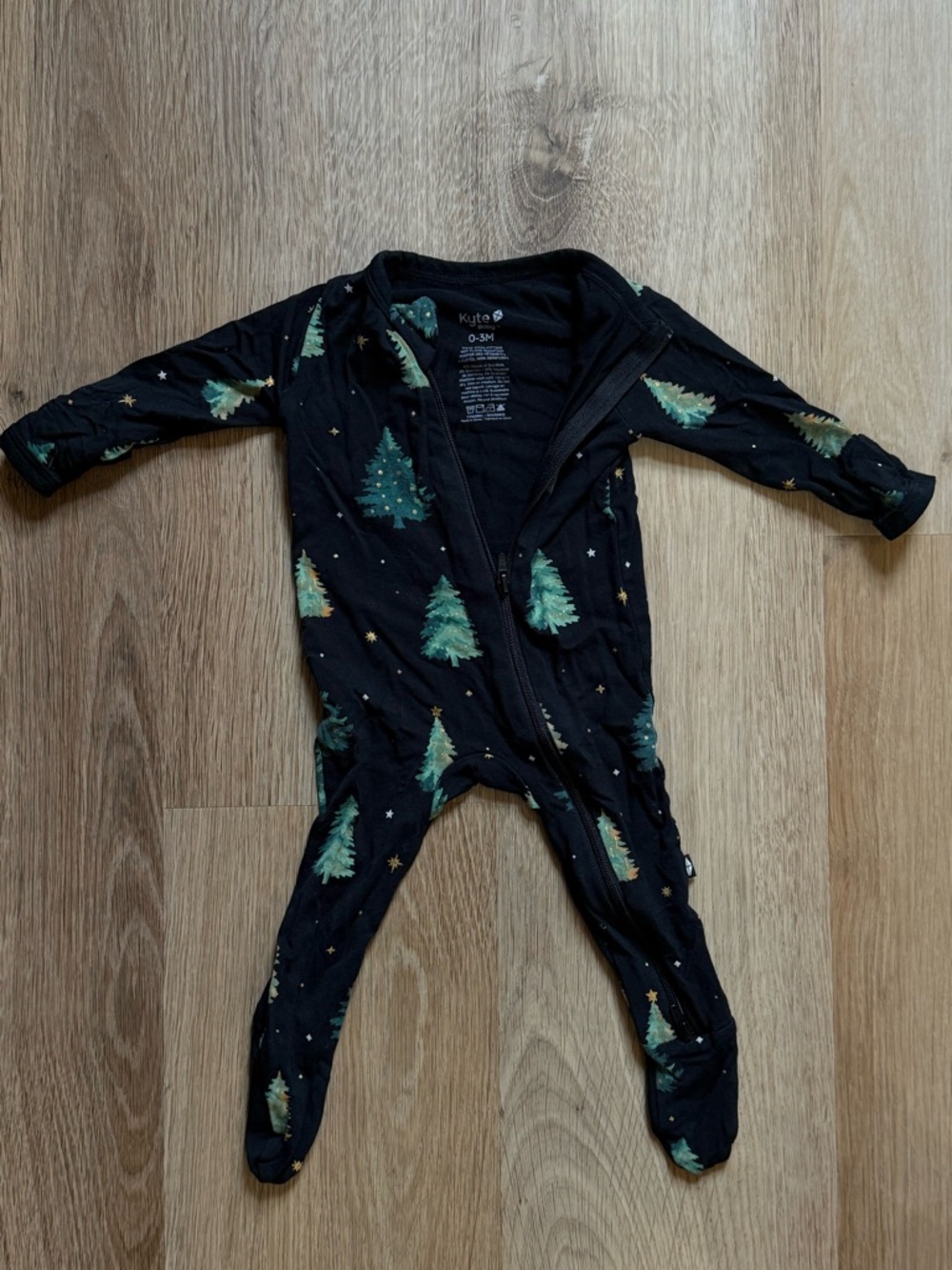 Kyte BABY Black Footed One-Piece with Green Tree Print